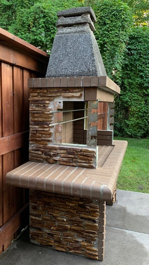 Outdoor Stone Kitchen With Firebrick Pizza Oven and Large Rotisserie bbq